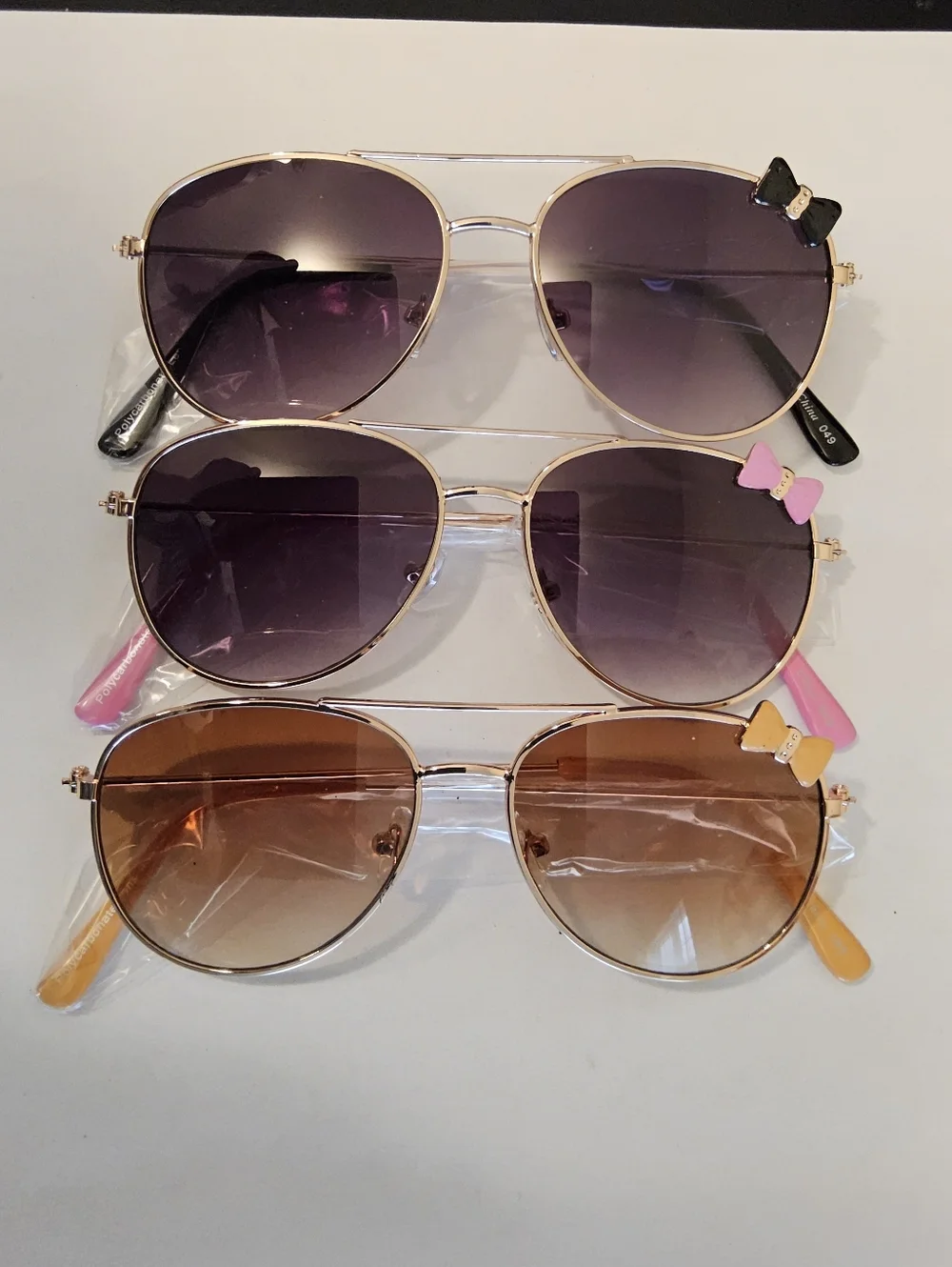 B. 3/$10. Aviator Sunglasses Trio with Decorative Bows